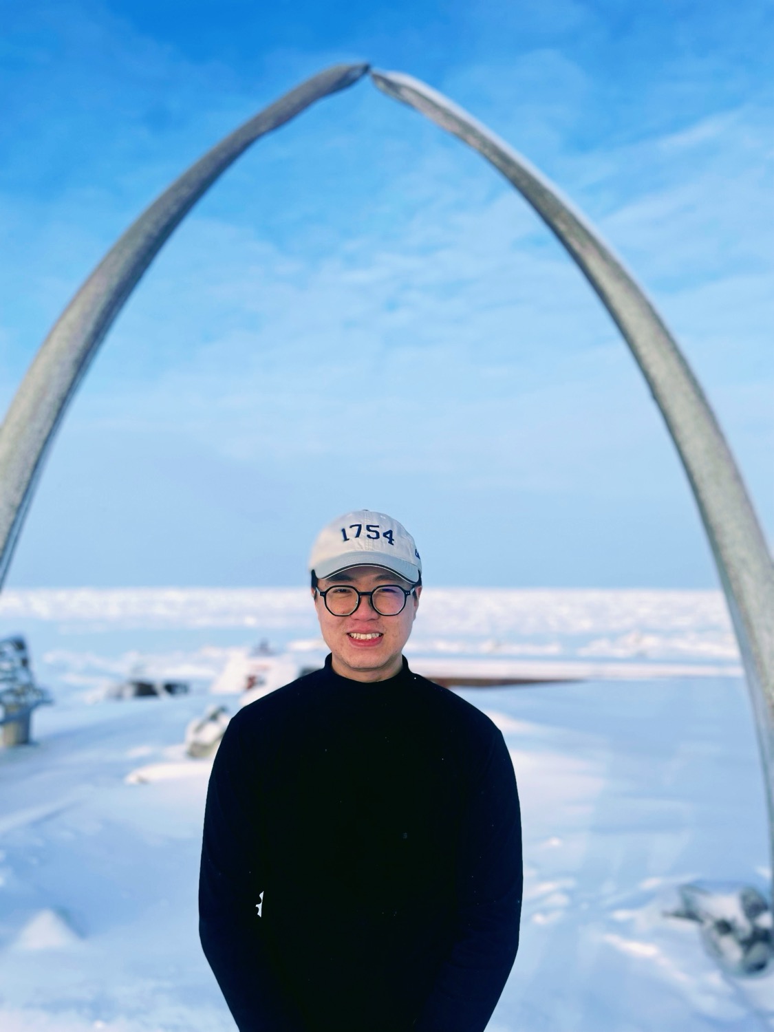 Lorenzo Chu at the Utqiaġvik whale-bone arch